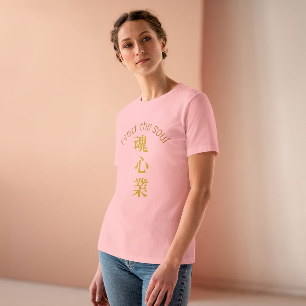 Woman wearing a pink t-shirt soul and hands feed the soul t-shirt with text on a peach-colored background
